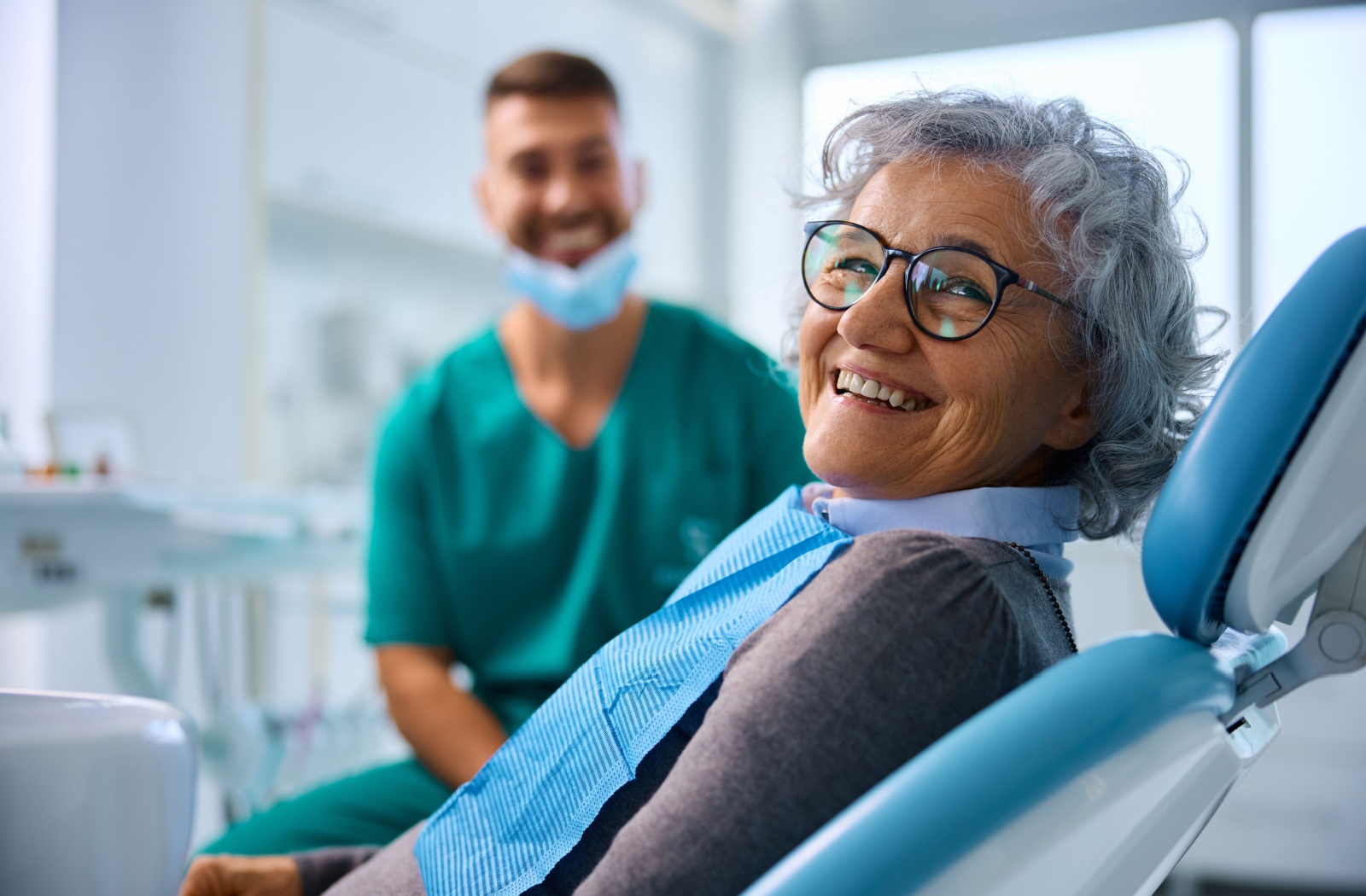 A patient at her dentist's office about to start her dental recall exam.