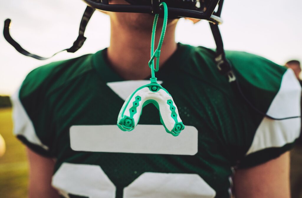 Football player with a custom mouth guard.